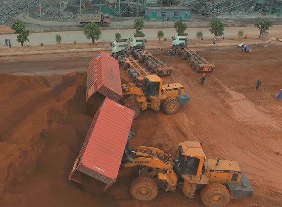Dual container loaders working side-by-side
